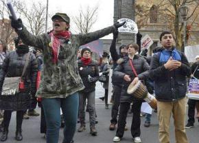 Vanessa Lynch-Zorlu (left foreground) leads protesters challenging racism and police violence