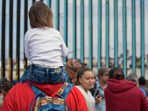 Protesters demand justice for migrants and refugees at the U.S.-Mexico border